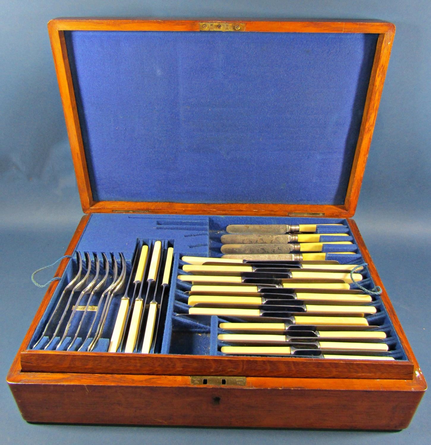 An oak canteen of Scottish Victorian silver shell patterned cutlery, the majority hallmarked to
