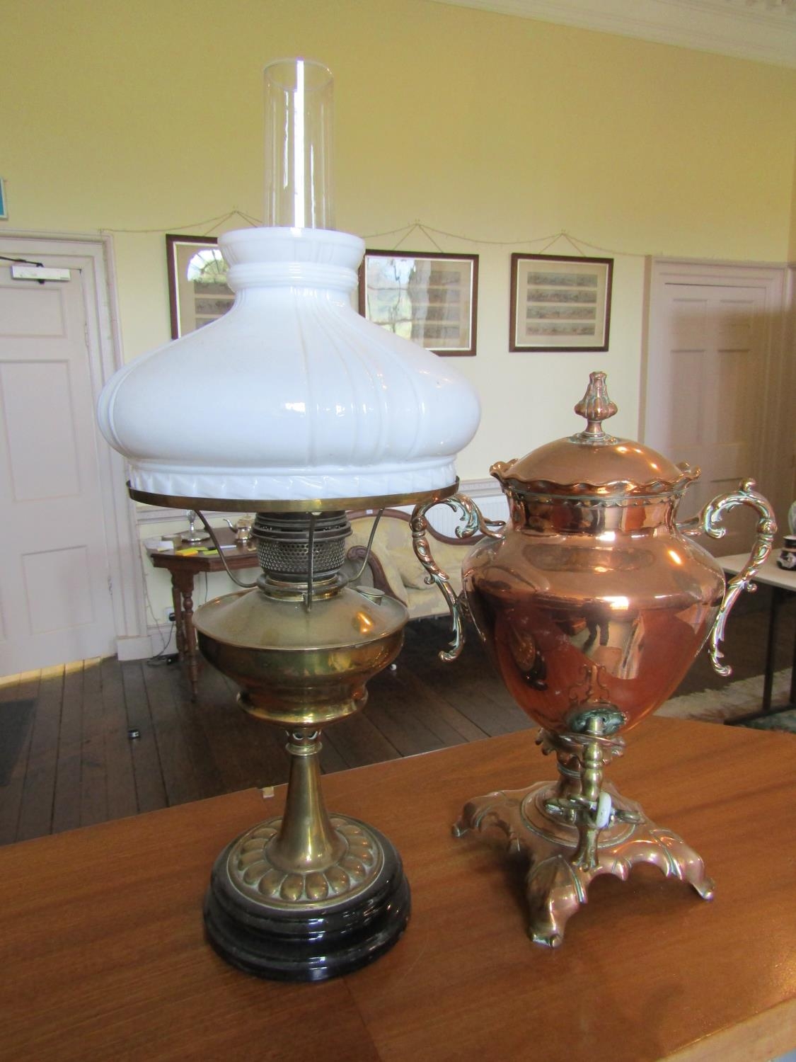 To be viewed at and collected from Nibley House GL11 6DL:A brass oil lamp with milk white shade