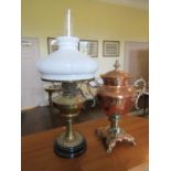 To be viewed at and collected from Nibley House GL11 6DL:A brass oil lamp with milk white shade