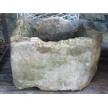 A weathered natural stone rectangular garden trough approx 50 cm long x 40 cm wide x 32 cm high