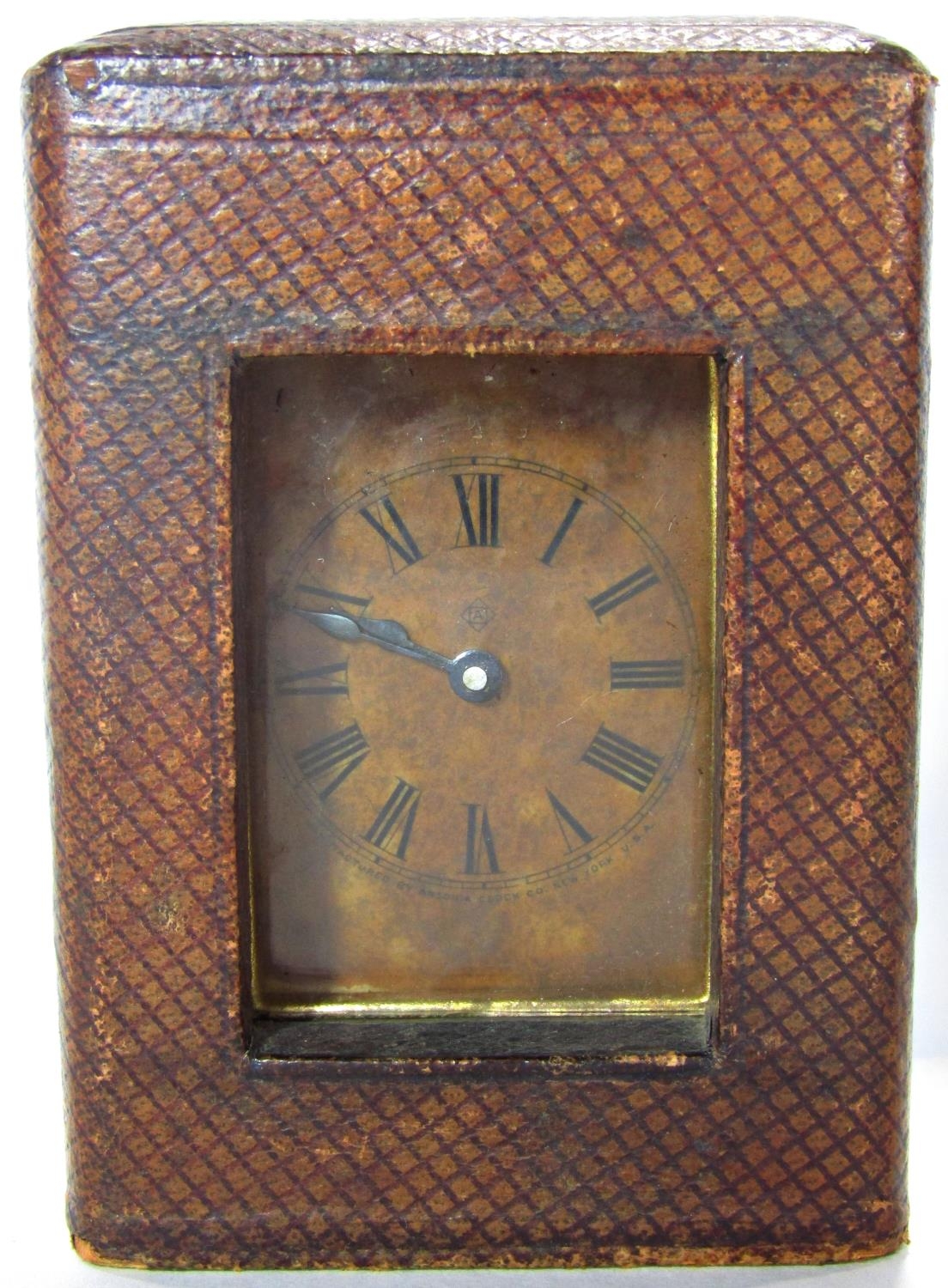 A small carriage clock with original leather travelling case, 9cm