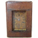 A small carriage clock with original leather travelling case, 9cm