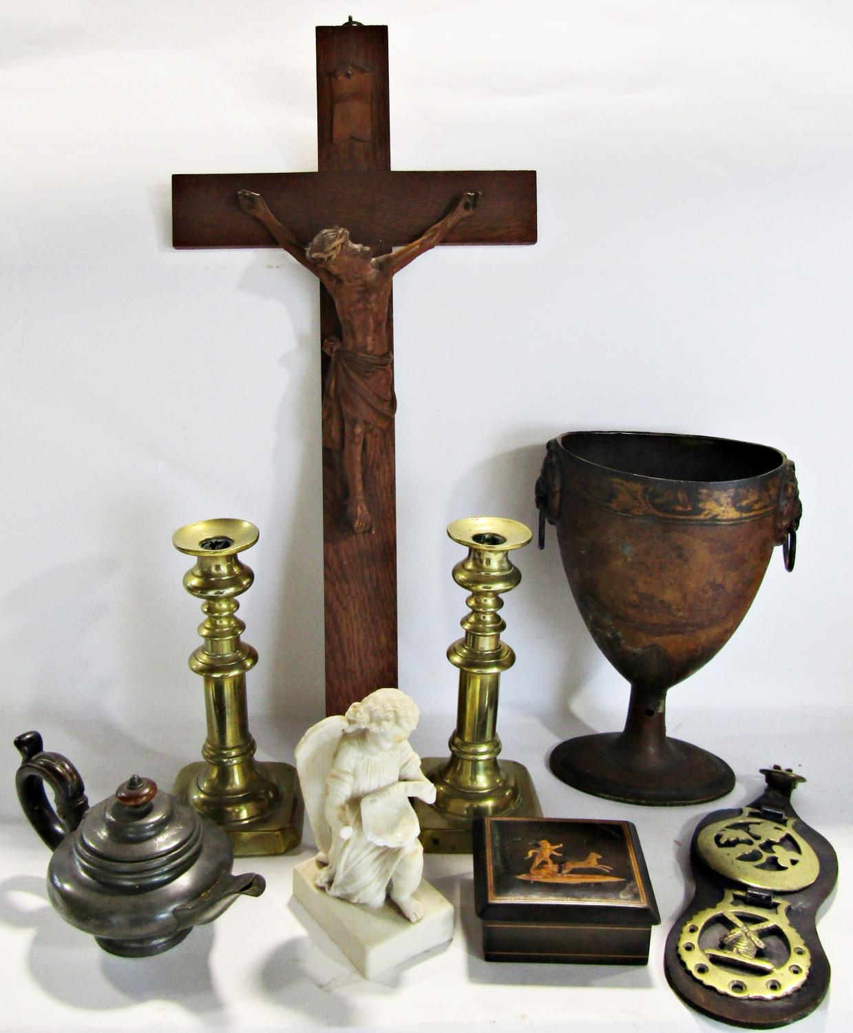 A miscellaneous collection of items including a pair of brass candlesticks, a Tole ware urn with