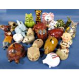 A collection of whimsical animals some in the form of moneyboxes to include pigs, cats, snails, etc
