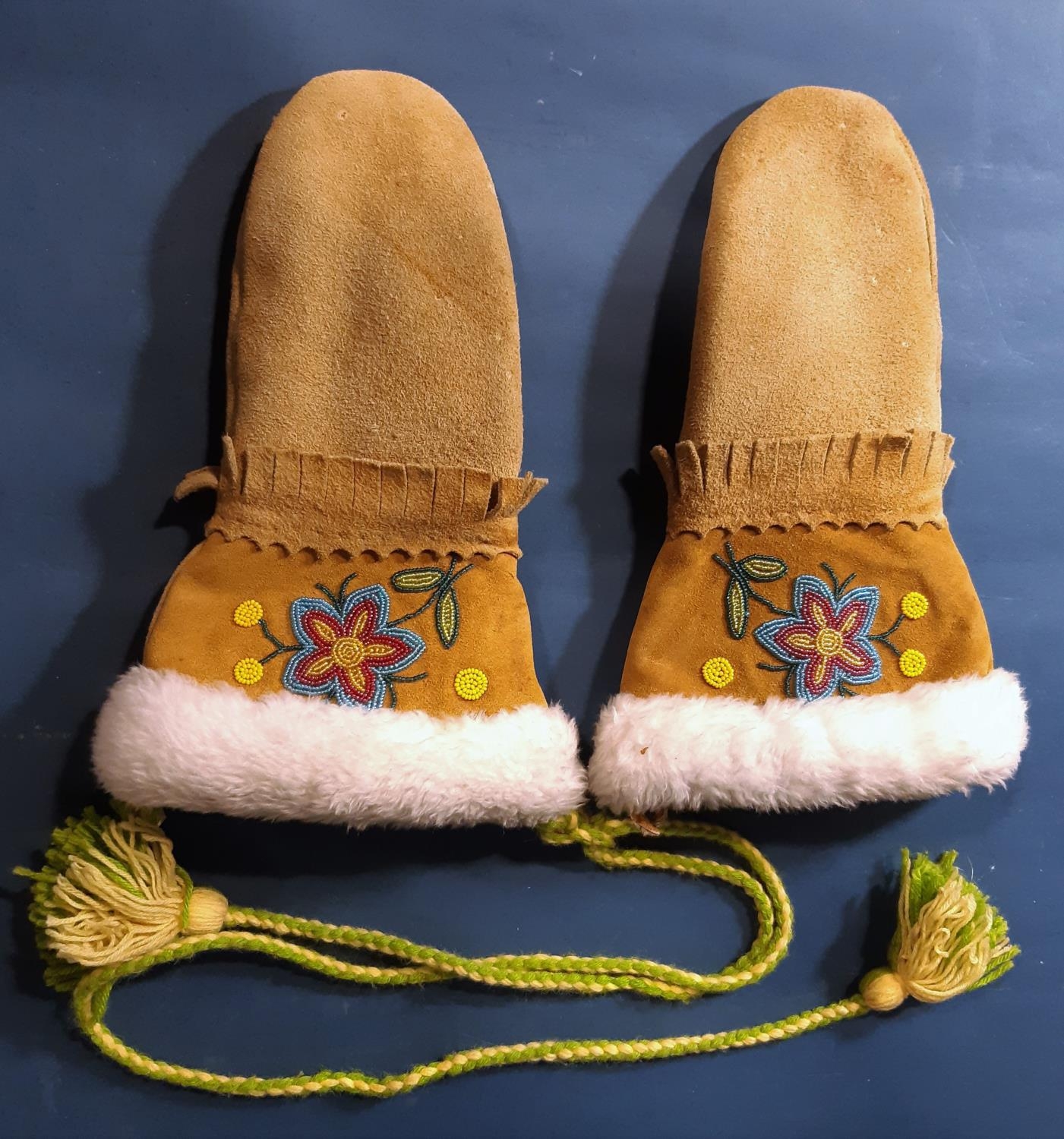 A pair of sheepskin mittens with long cuff and floral beading detail, North American Native style,
