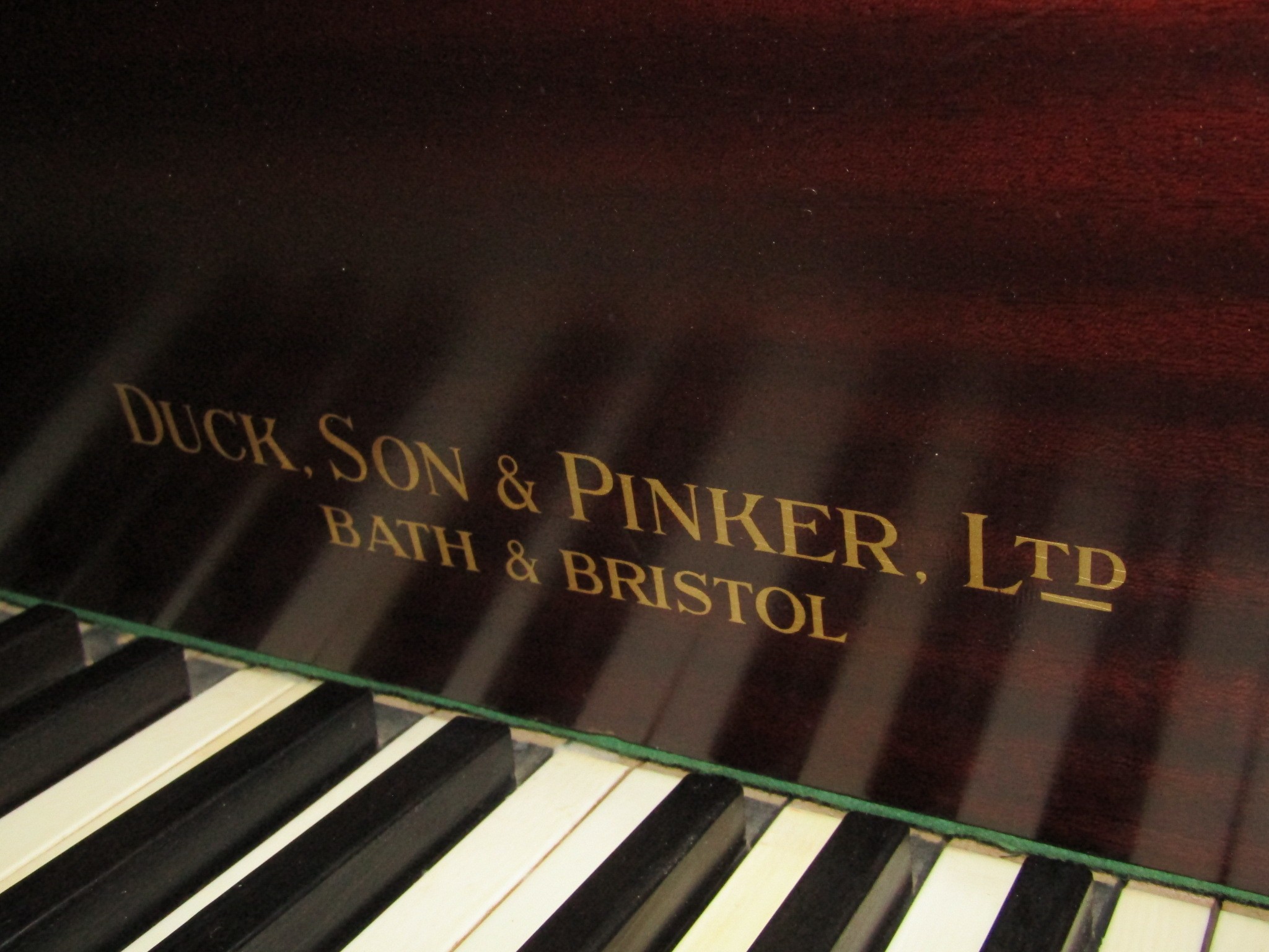 A Baby Grand Piano retailed by Duck Son & Pinker in a polished mahogany cased raised on three square - Image 3 of 4