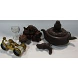 A Chinese carved wooden ink stand with goats, a clay Chinese teapot on a box, a copper Chinese three