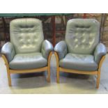 An Ercol three piece lounge suite comprising three seat sofa and pair of matching armchairs with