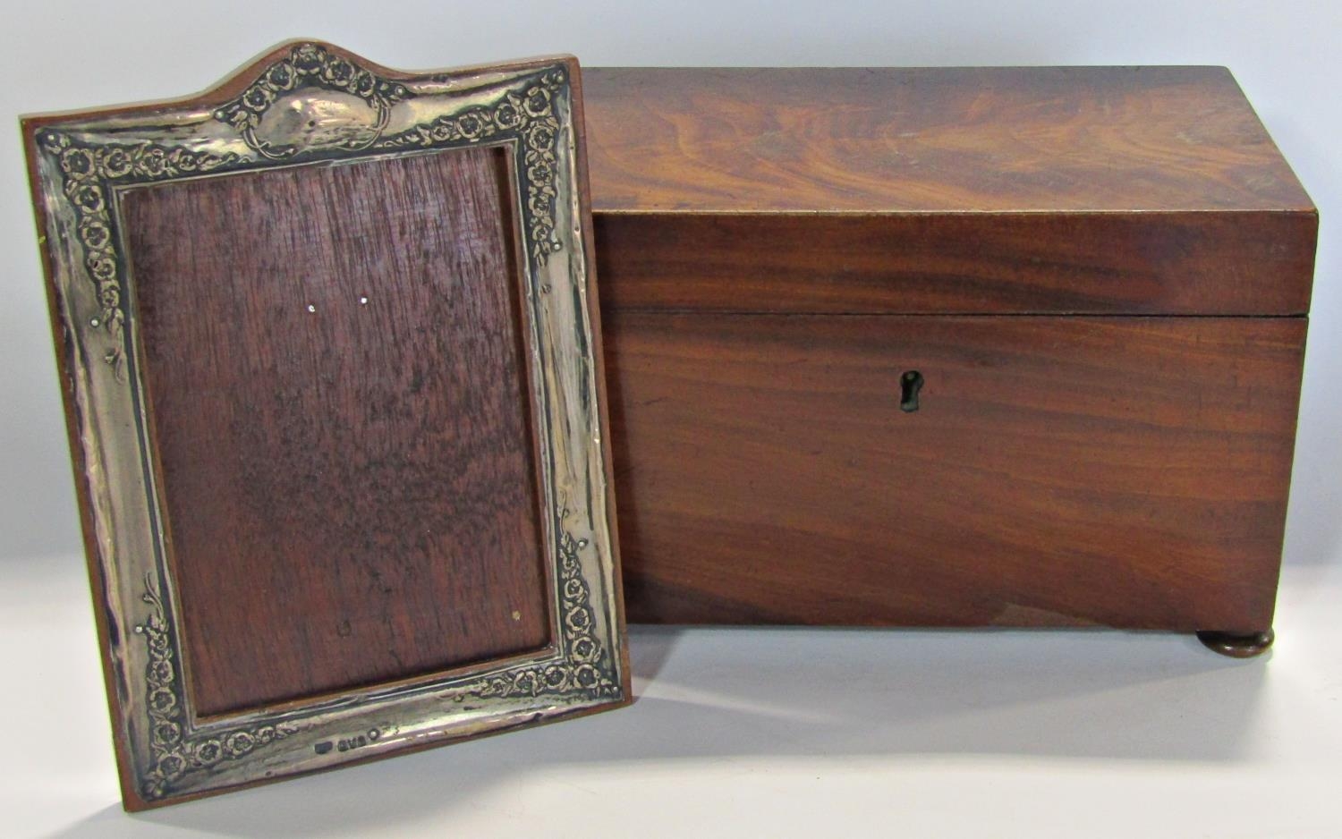 19th century mahogany tea caddy (af)and a silver mounted wooden photo frame.