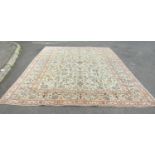 A good quality Central Persian Kashan carpet with large floral palmettes spread over a pale blue