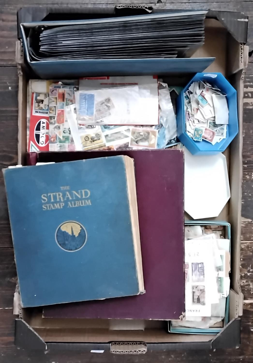 A mixed collection of items to include two stamp albums, loose assorted stamps, FDC's, further