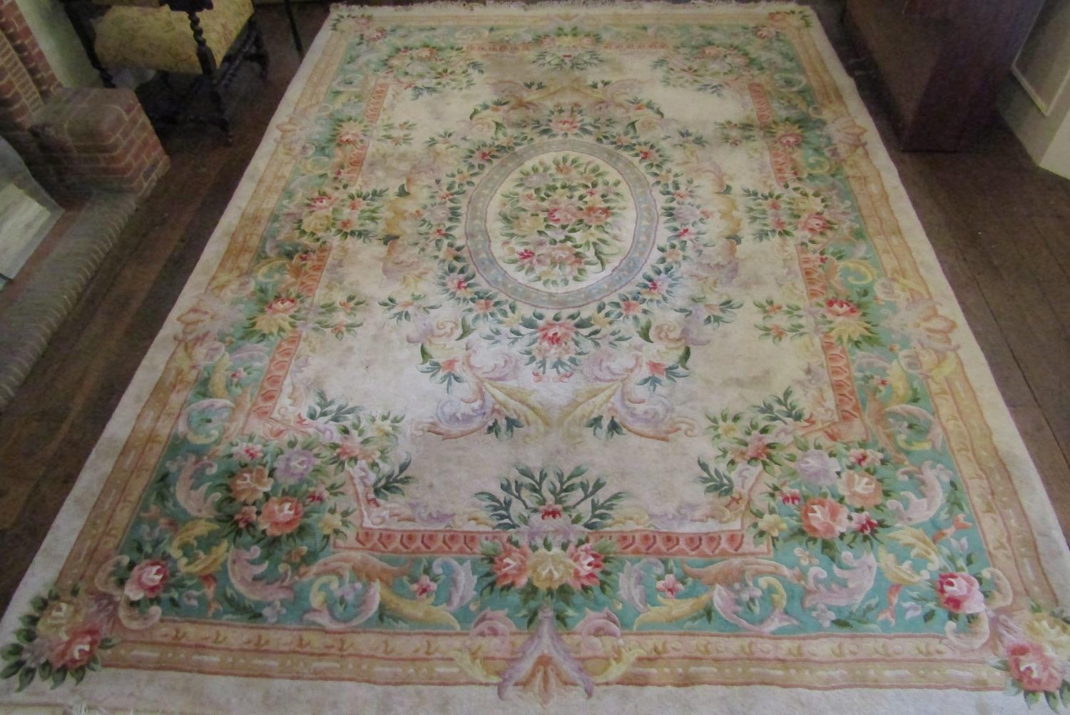 To be viewed at and collected from Nibley House GL11 6DL:A Chinese washed wool carpet