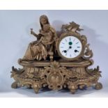 19th century gilt brass mantle clock, the decorative case showing mother and child with eight day