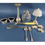 An assortment of silver and silver plated tableware including a posy vase, salt cauldrons, a