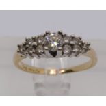 14k diamond cluster ring, centre stone 0.20cts approx, size O, 2.8g