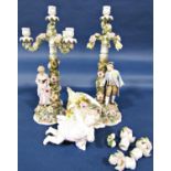 A pair of substantial Victorian three branch candelabra, each floral encrusted base supported by