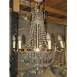 A six branch chandelier in brass and cut glass approx height 70 cm plus chain, 60 cm diameter