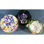 A collection of seven paperweights, including a Perthshire single flower signed P to a cane, a