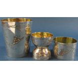 A French silver beaker, eggcup and napkin ring, engraved with ears of wheat, bearing the head of