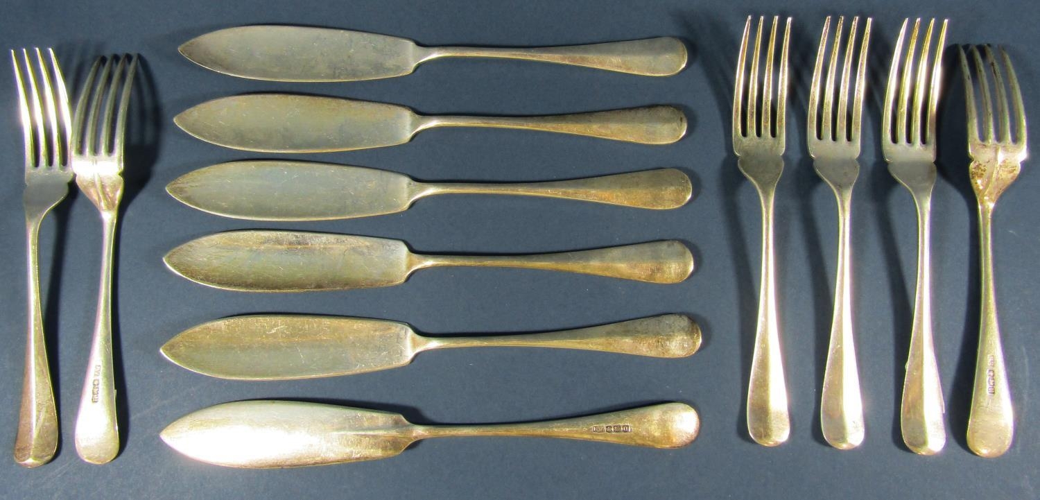 A set of Georgian style silver rat tail fish knives and forks for six settings, Sheffield 1937,