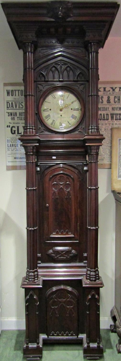 A most unusual Victorian gothic longcase clock, the case supported by four columns, the trunk with