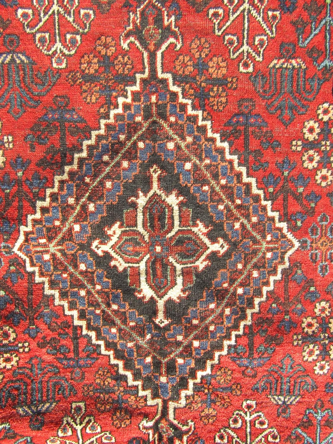 A North West Persian Josheghan rug with central diamond medallion and repeated floral patterns in - Image 2 of 2