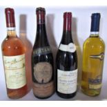 A mixed selection of alcohol including varieties of red and a white wine, Chablis, Montepulciano