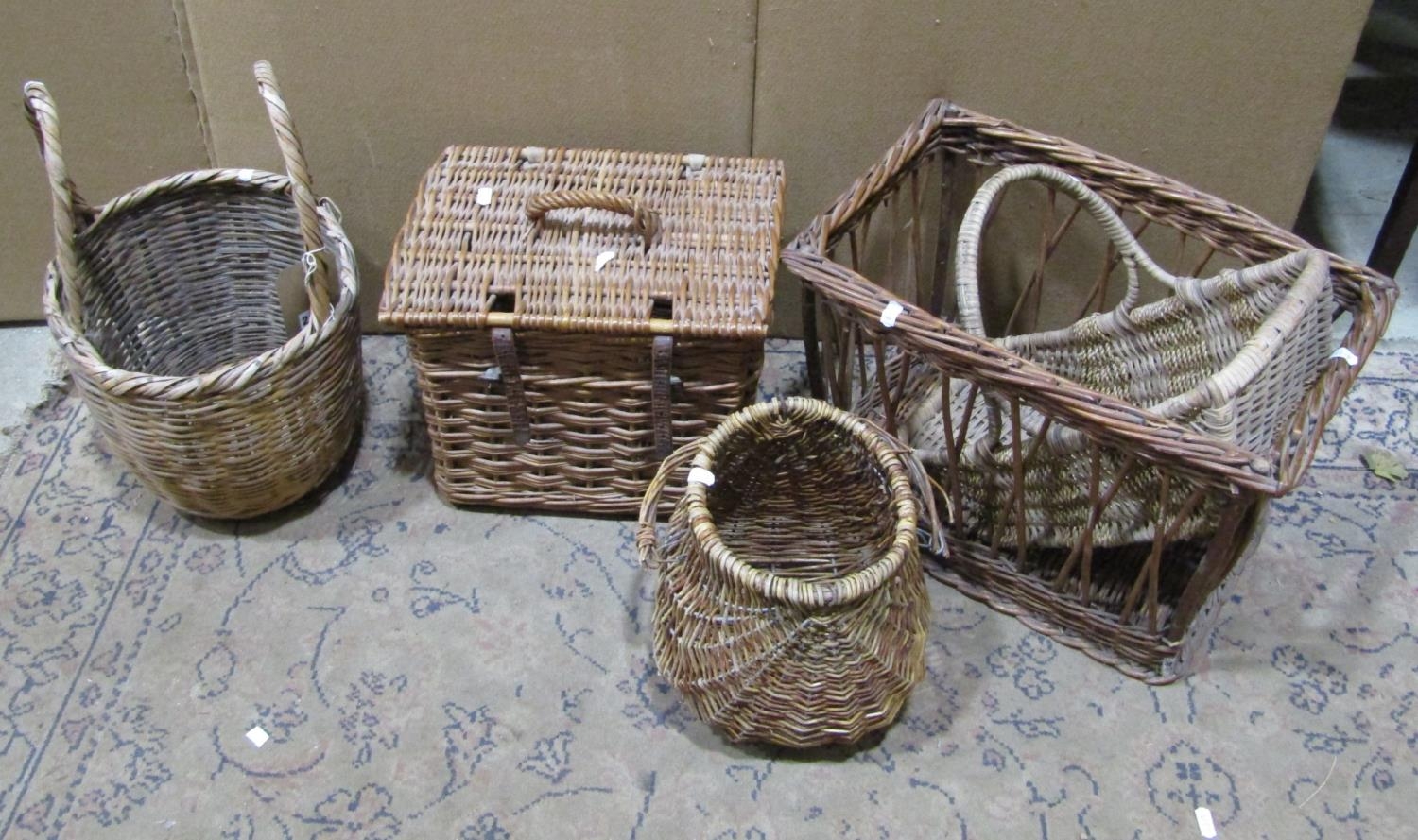 Five vintage wicker baskets of various size and design