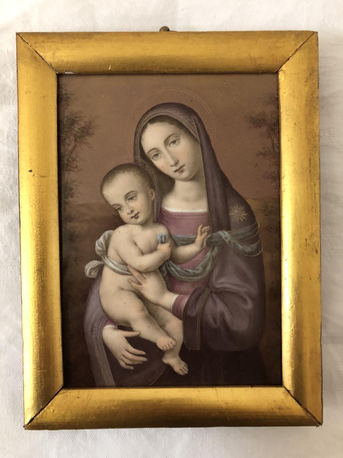 19th century hand-painted and gilt plaque of Virgin Mary holding infant Jesus, 14.5 x 10.5 cm,