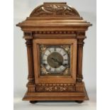 19th century German bracket clock in a walnut case with square brass dial and silvered chapter