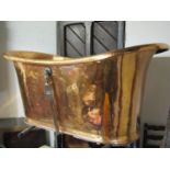 A copper roll top bath approximately 160cm long x 70 cm wide x 70cm high