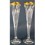 A pair of Moser hand cut facetted crystal Champagne flutes with 24 carat gold rim, made in