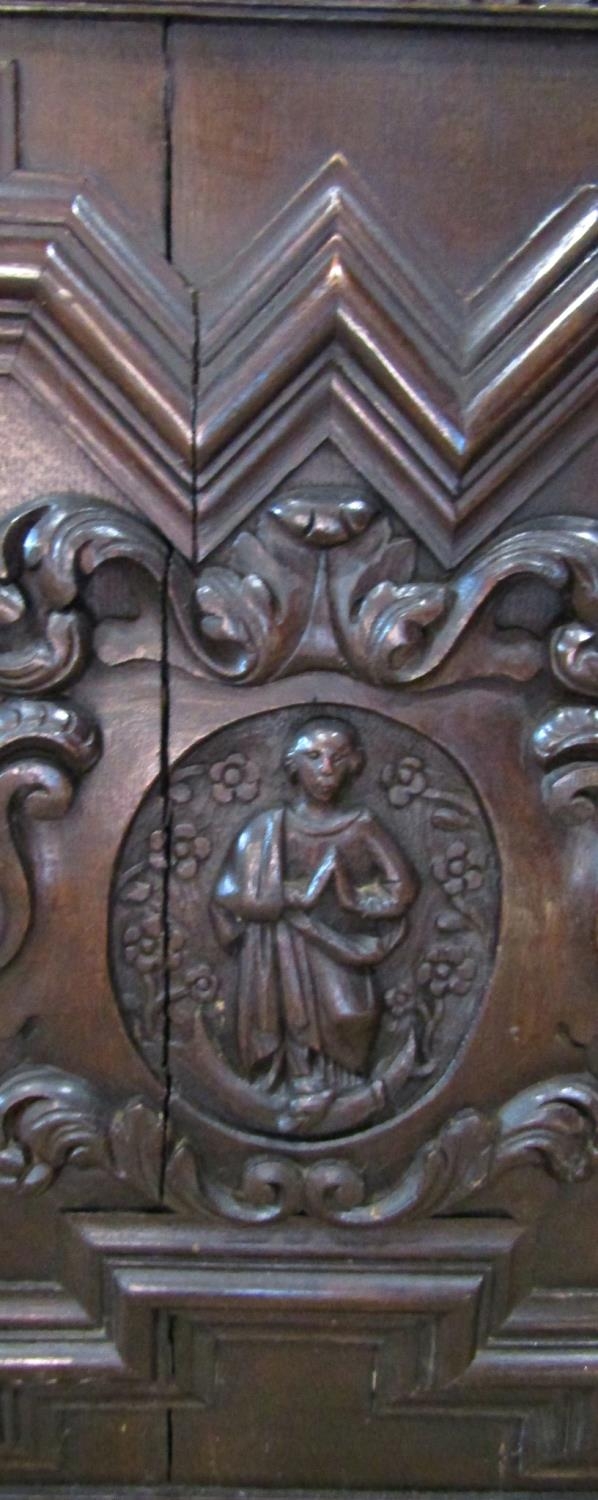 A substantial 19th century oak side cupboard enclosed by a pair of panelled doors, oval portrait - Image 4 of 4