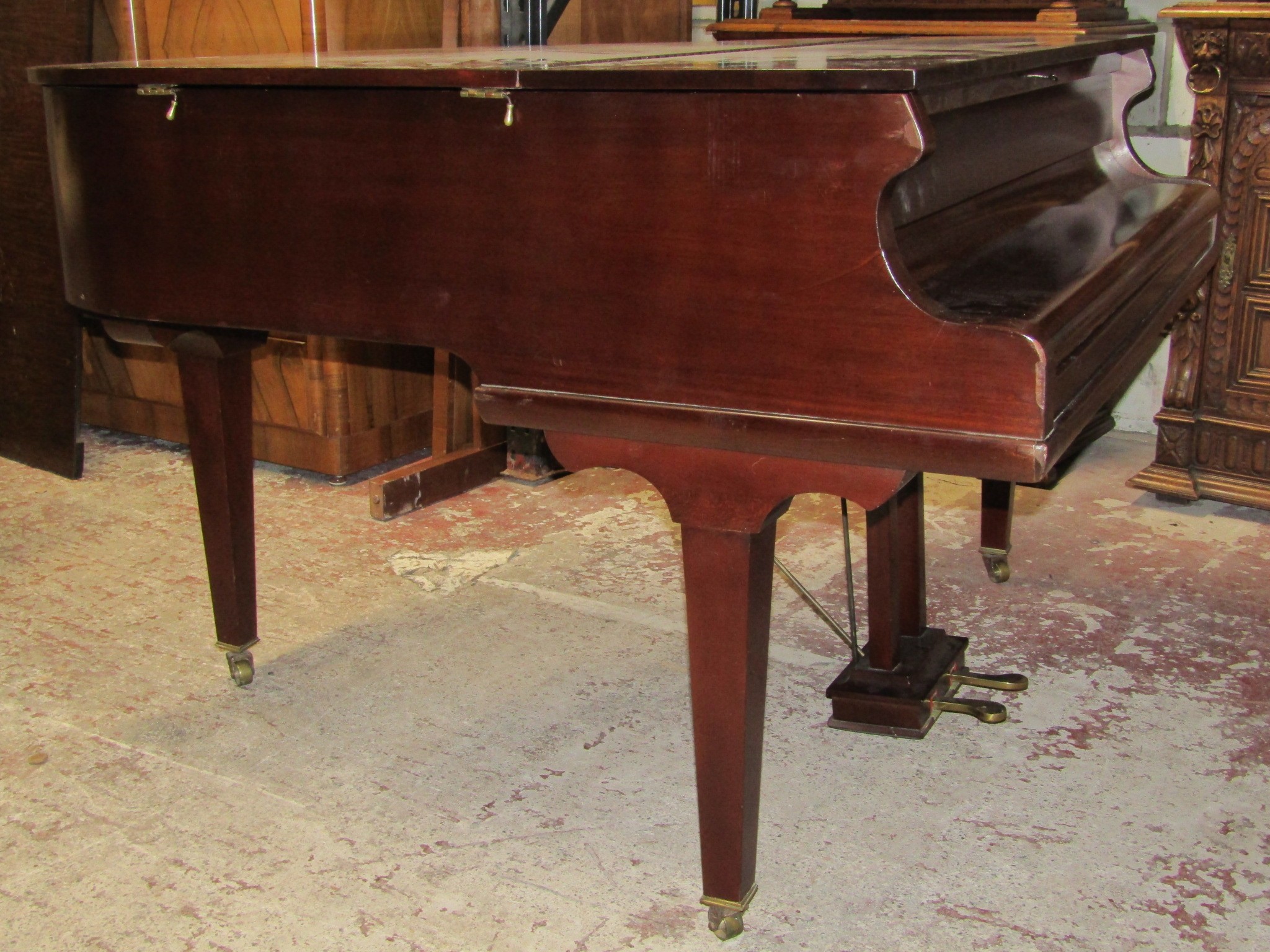 A Baby Grand Piano retailed by Duck Son & Pinker in a polished mahogany cased raised on three square - Image 2 of 4