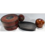 Three South East Asian lacquered coiled bamboo boxes, and an oval black lacquered box.