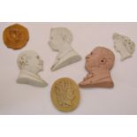 Four 19th century continental bisque busts, agate letter knife, ivorine letter knife with portrait