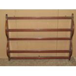 An inlaid Edwardian wall mounted plate rack with shaped outline 87cm w x 68cm h x12cm d