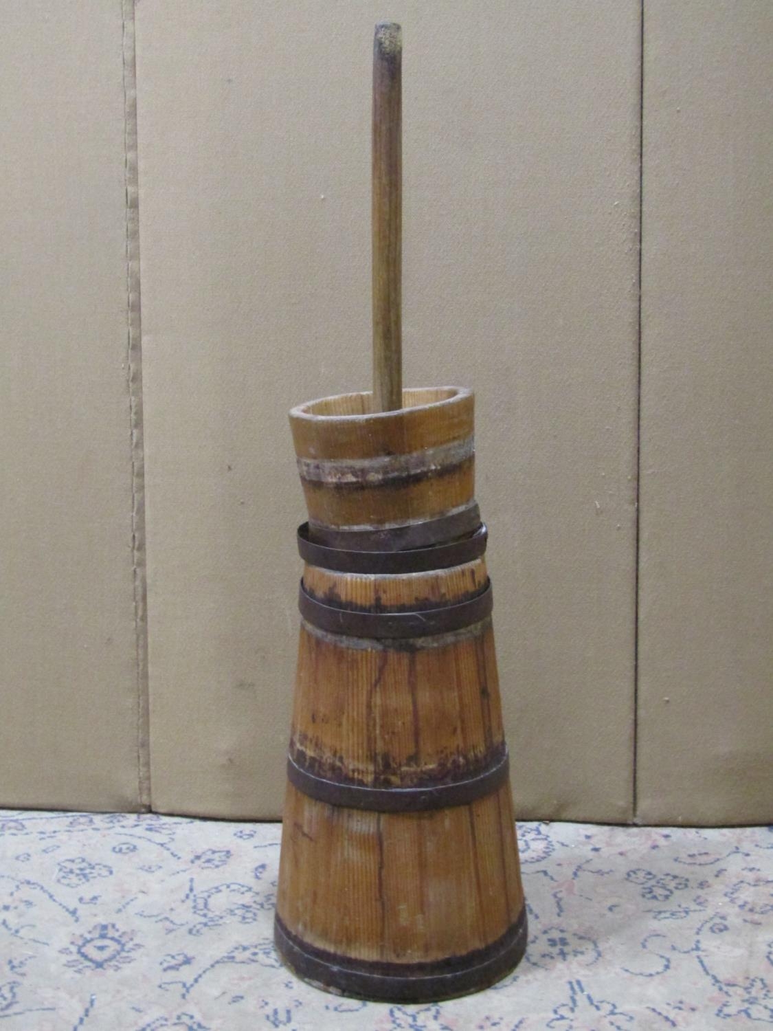 A vintage coopered pine and steel banded butter churn, complete with dasher