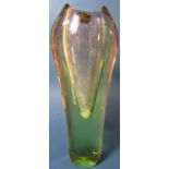 A Scandinavian style vase with a clear glass centre cased in pale green 26cm high, a ship’s