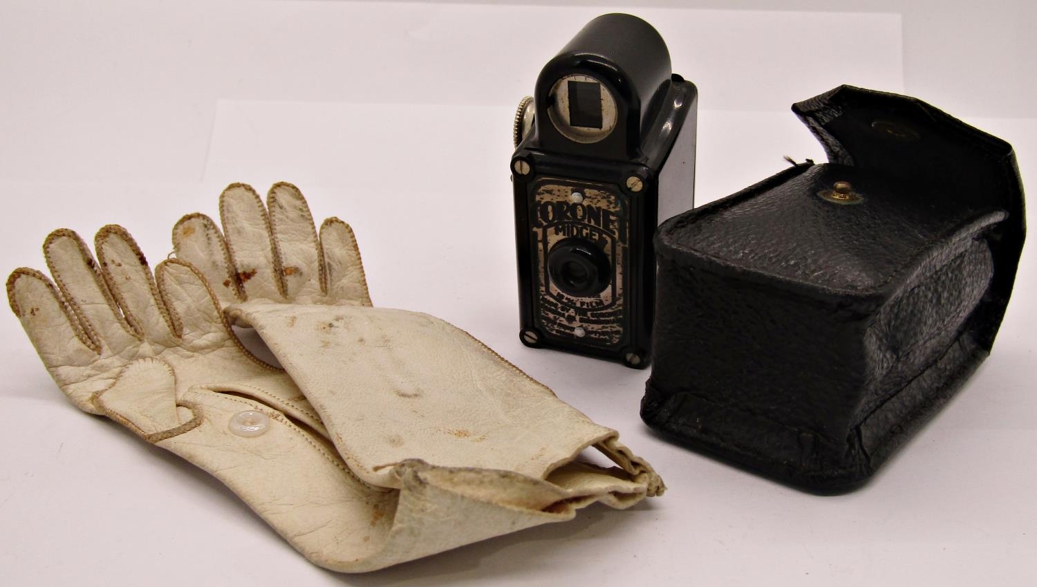 Pair of 19th miniature kid gloves 12cm max length and a coronet midget camera with black Bakelite