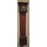 An early 20th century oak grandmother clock 155 cm high enclosing a square six inch brass dial