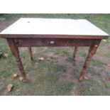 A Victorian stained pine kitchen table of rectangular form with later formica top, 107 cm x 68 cm (