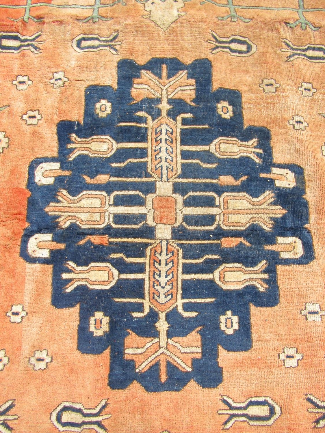 A large Turkish carpet with a central stepped medallion and stylised flowers on a pink ground, 237cm - Image 2 of 2