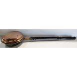 19th century copper bed warming pan and a brass jam preserving pan with a swing handle, and a