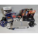A bundle of electronic consoles and games including Play Station 2, Sega Megadrive Pal-1, Nintendo