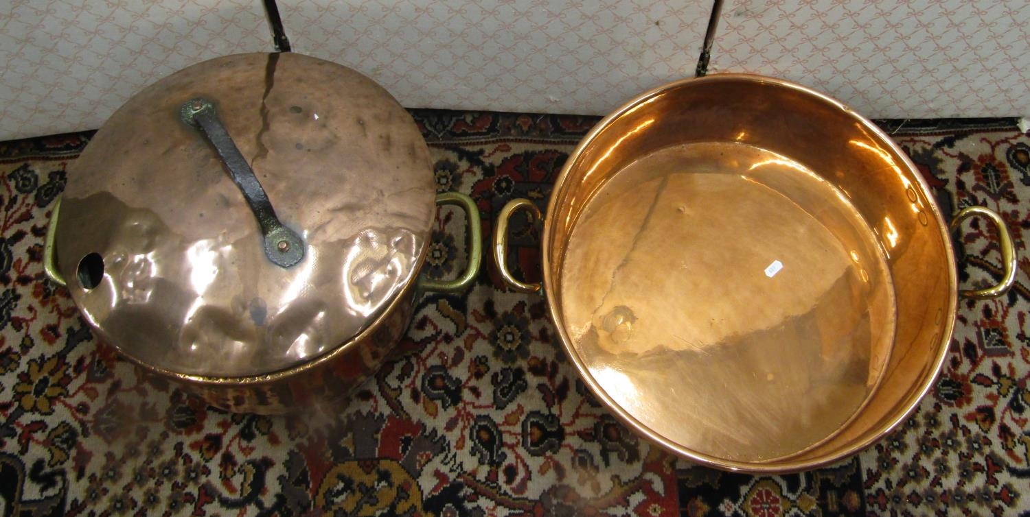 A heavy 19th century copper pot with brass an iron handles, 40cm diameter, together with a large - Image 2 of 3