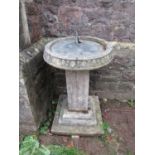 A four sectional garden sun dial, the large circular weathered brass/possibly bronze dial with