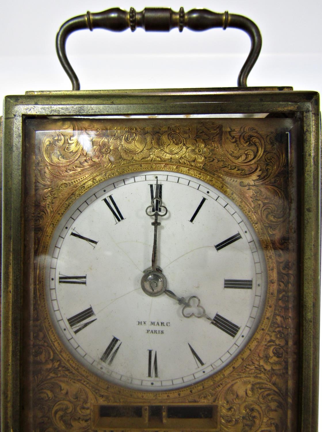 a late 19th century French eight day carriage clock with circular enamel dial set within a chased - Image 4 of 4
