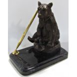 Bronze brown bear pen holder with a single gilt swivel holder and double ended pen.