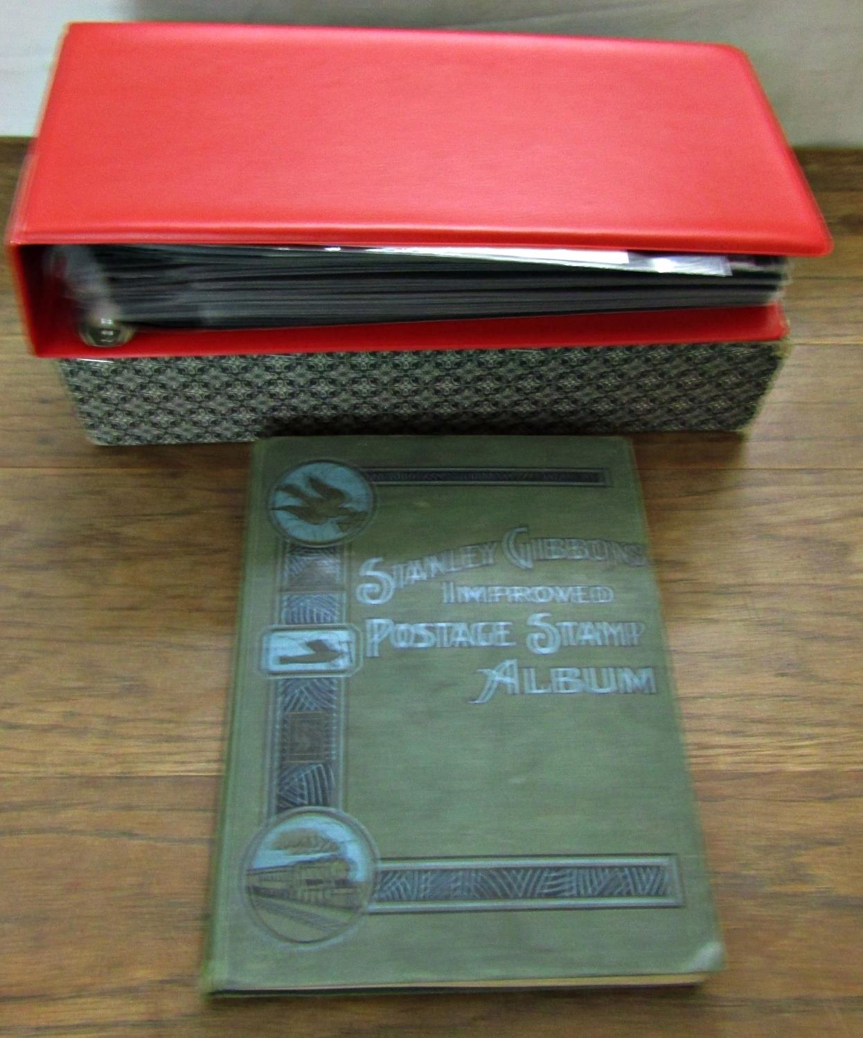 A stamp book containing British and worldwide stamps including a penny red and two penny blue
